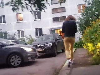Young woman&#039;s ass in yellow pants