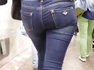Behind the young woman with tight round ass